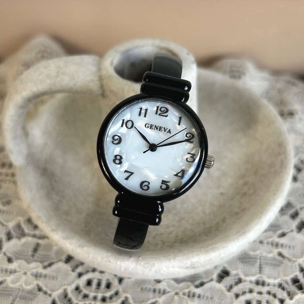 Geneva Womens Black Cuff Bangle Watch Mother of Pearl Dial Stainless Steel Back